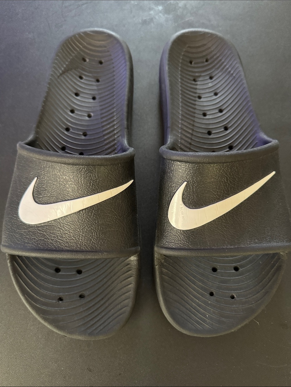Nike Black Slides with White Swoosh Logo